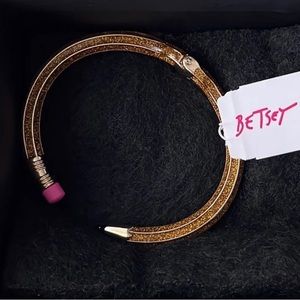Betsy Johnson pencil bracelet. I got it as a gift and won’t wear it.